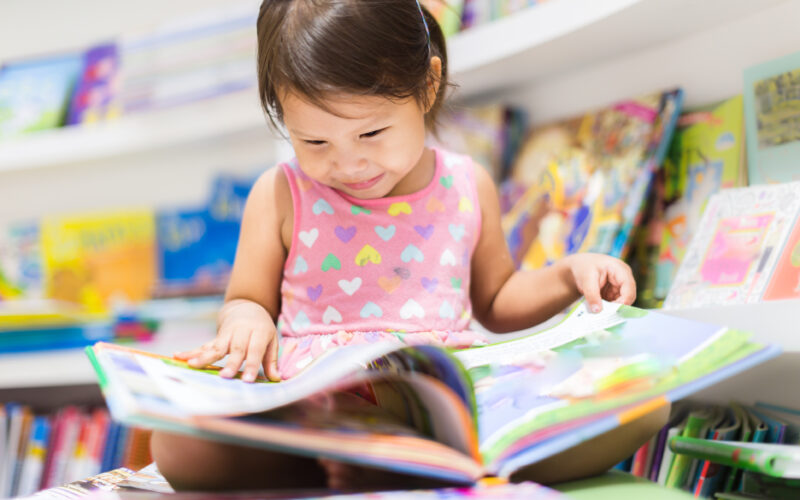 Photo of child reading a book